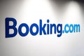 Booking.com logo on a white wall of an office