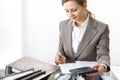 Bookkeeper woman or financial inspector making report, calculating or checking balance. Business portrait. Copy spac