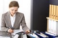 Bookkeeper woman or financial inspector making report, calculating or checking balance. Business portrait. Copy spac