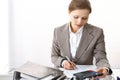 Bookkeeper woman or financial inspector making report, calculating or checking balance. Business portrait. Copy spac