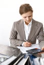 Bookkeeper woman or financial inspector making report, calculating or checking balance. Business portrait. Copy spac