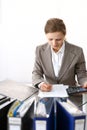 Bookkeeper woman or financial inspector making report, calculating or checking balance. Business portrait. Copy spac