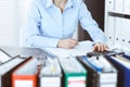 Bookkeeper woman or financial inspector making report, calculating or checking balance, close-up. Business, audit or tax