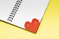 Bookmark heart with eyes for a book on a yellow background close up