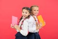 These books are absolutely genius. Genius little children smiling on red background. Happy genius girls or wonder kids