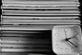 The books and the allarm clock in black and white