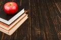 Books and an apple on wooden table. Teacher's day concept and back to school Royalty Free Stock Photo