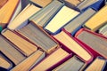 Books, a background of old battered books with colored paper