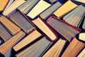 Books, a background of old battered books with colored paper