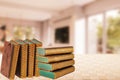 Books backgrounds. Closeup of a stack or pile antique books on a table over abstract blurred home office. Education concept.