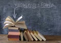 Books and blackboard with slogan knowledge  is power,learning,education,personal development and back to school concept Royalty Free Stock Photo