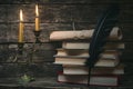 Books and burning candle. Royalty Free Stock Photo