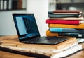 books colorful stack next laptop a book computer concept isolated digital education cyclopaedia cognition learn notebook school Royalty Free Stock Photo