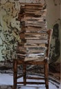A pile of books on a chair