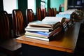 Books on a desk in a school library. Selective focus