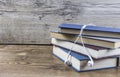 Books and earphone lay on wooden table. Royalty Free Stock Photo