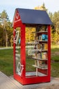 Books exchange point in the Glinianki park near Warsaw, red book swap booth