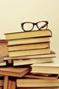 Books and eyeglasses in an old suitcase, with a retro effect Royalty Free Stock Photo