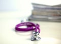 Books folder file and stethoscope isolated on Royalty Free Stock Photo