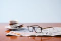 Books, glasses and cup cafe co on a wooden table Royalty Free Stock Photo