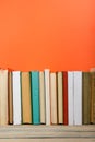 Books on grunge wooden table desk shelf in library. Back to school background with copy space for your ad text. Old Royalty Free Stock Photo