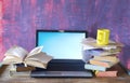 Books, laptop, reading, learning, working, education, messy workplace,copy space Royalty Free Stock Photo