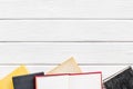 Books on library desk for reading and education on white wooden background top view mockup