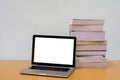 Books with Notebook (laptop) on wood table, Education, Thesis, blank screen