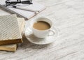 Books, open a blank notepad and a cup of tea with milk Royalty Free Stock Photo