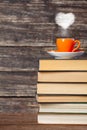 Books pile and cup of coffee with heart shape Royalty Free Stock Photo