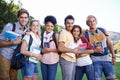 Books, portrait or students in park at college, campus or together with community, smile or group. University, diversity Royalty Free Stock Photo