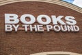 Books by the pound retail book store wall sign