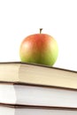 Books pyramid with apple on top Royalty Free Stock Photo