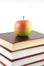 Books pyramid with apple on top Royalty Free Stock Photo