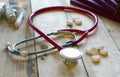 Books , red stethoscope , pills Royalty Free Stock Photo