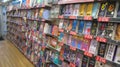 Books for sale on shelves in a WH Smiths newsagents in Bedford, United Kingdom.