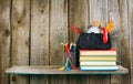 Books and school tools on a wooden shelf. Royalty Free Stock Photo