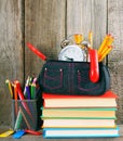 Books and school tools on a wooden shelf. Royalty Free Stock Photo