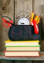 Books and school tools on a wooden shelf. Royalty Free Stock Photo
