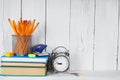 Books and school tools on a wooden shelf. Royalty Free Stock Photo