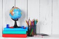 Books and school tools on a wooden shelf. Royalty Free Stock Photo