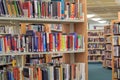 Books on a shelf in library.