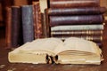 Books shelf with old open book Royalty Free Stock Photo