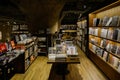 Books on shelves and tables in underground bookstore