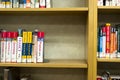 Books Sitting on a Bookshelf