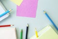 Books, sketchbook and colorful pencils on the table, top view, save space, back to school concept Royalty Free Stock Photo