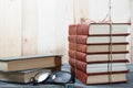 Books stacked on wooden desk in university Royalty Free Stock Photo