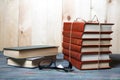 Books stacked on wooden desk in university Royalty Free Stock Photo