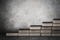 Books stair with copy space on wall Royalty Free Stock Photo