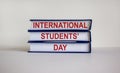 Books with text `International Students Day` on beautiful white background. Business and educational concept. Copy space Royalty Free Stock Photo